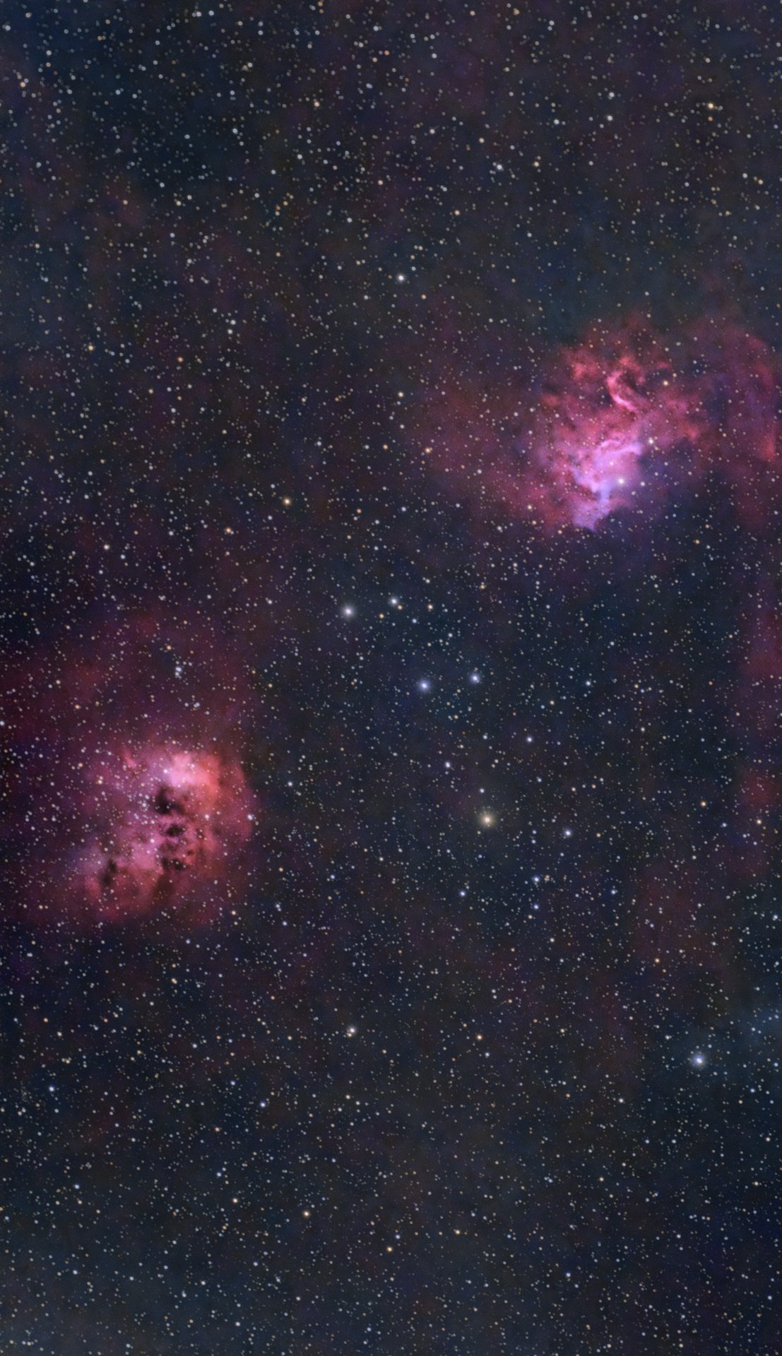 A deep-sky image of NGC 1893 against a star-rich background.